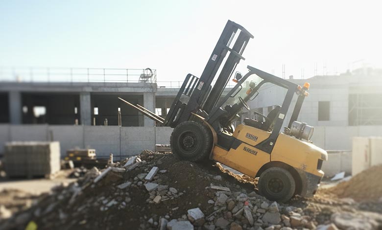 A diagram showing a forklift high-centered on a mound, with its wheels losing contact with the ground.