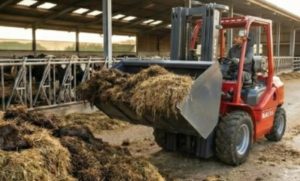 Forklift with Loader Bucket A BLANC-ELE forklift equipped with a hydraulic bucket scooping gravel on a construction site.