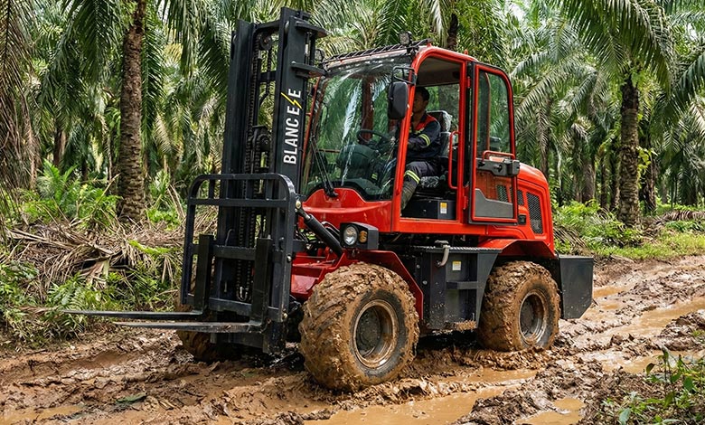 A BLANC-ELE 4WD rough terrain forklift confidently maneuvering between palm trees on uneven, muddy ground.