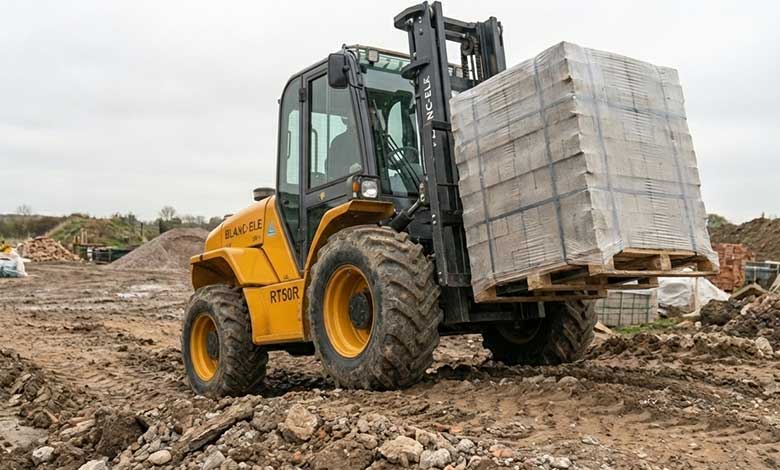 Mast rails and fork carriage on a BLANC-ELE RT50 rough terrain forklift