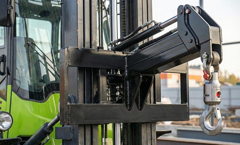 BLANC-ELE rough terrain forklift with crane jib attachment in real outdoor application