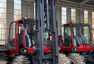 Rough terrain forklifts lined up in a manufacturer workshop for importer pre-order checking