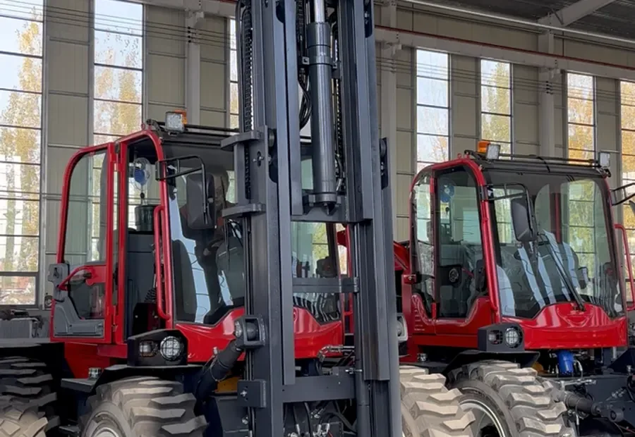 Rough terrain forklifts lined up in a manufacturer workshop for importer pre-order checking