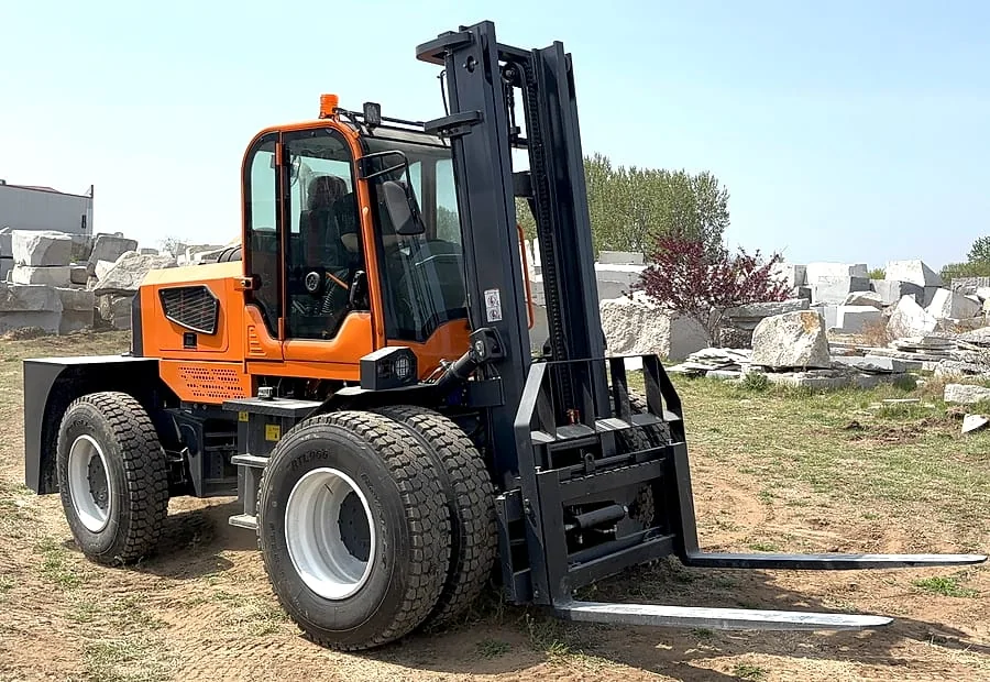 Rough terrain forklift with long forks prepared for outdoor load center checking