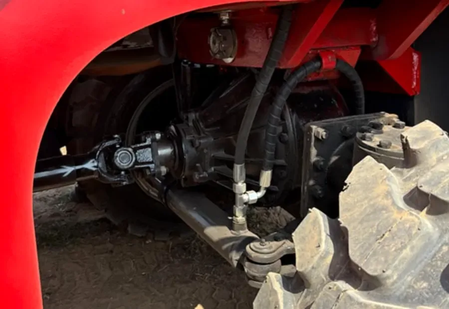 Rough terrain forklift steering linkage and tire detail for checking drive type and turning control