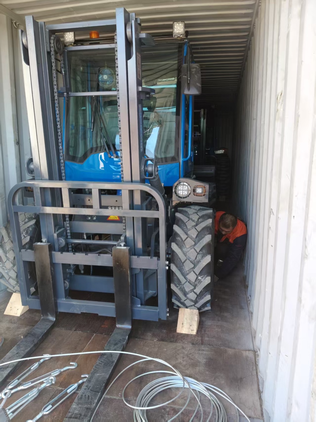 Rough terrain forklift loaded into a container before export delivery