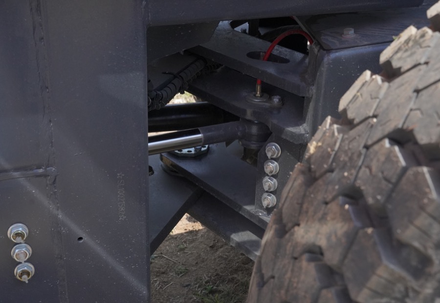 Rough terrain forklift tire and chassis detail for checking ground clearance before ramp work