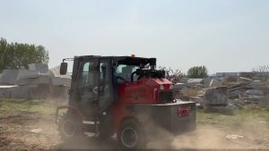 Rough terrain forklift moving across outdoor construction site route